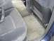 1999 Ford Taurus - The interior of a 1999 Ford Taurus shows worn rear seats and floor mats.