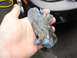 1999 Ford Taurus - A hand holds a used clay bar, showing the contaminants it has picked up from a surface.