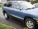 1999 Ford Taurus - This blue SUV, likely from around 2001, is shown from the side.