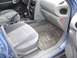 1999 Ford Taurus - Interior view of a car's passenger side, showing the seat and dashboard area.