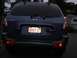 1999 Ford Taurus - The rear view of a blue Hyundai Santa Fe SUV is shown, with its license plate clearly visible.