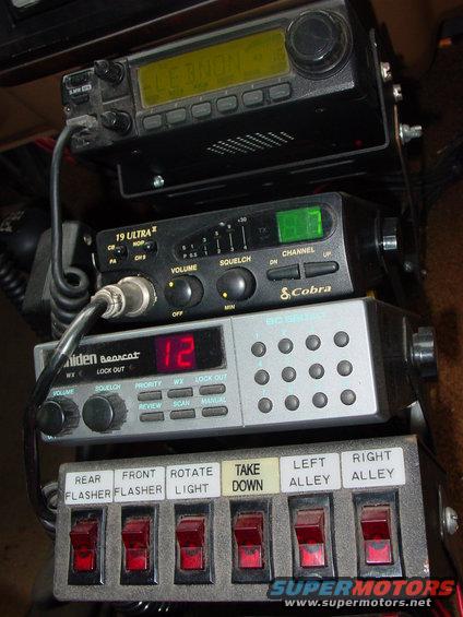 Front on view of Icom 2100h, Cobra 19 ultra 2, Uniden BC560XLT, 6 switch box.
