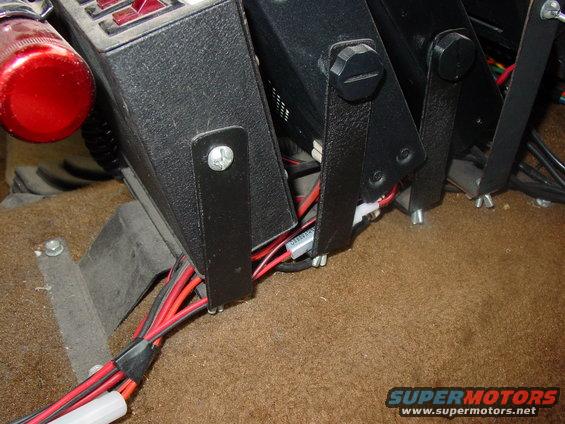 Close up of the base of the rack, mounted to the floor with 4 screws to the trans access pannel.  Made of 16ga steel with rattle can paint job.