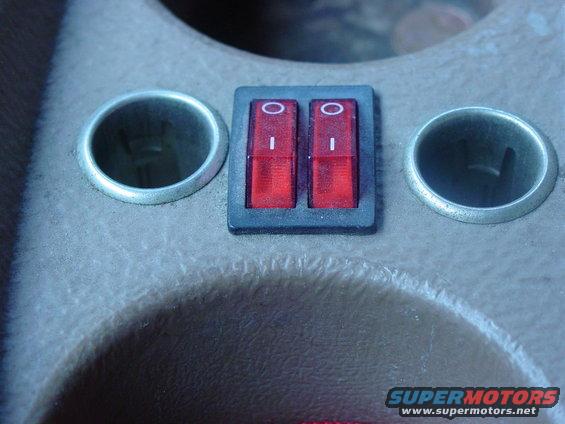Problem solved, switched 12vt outlets between the cup holders.