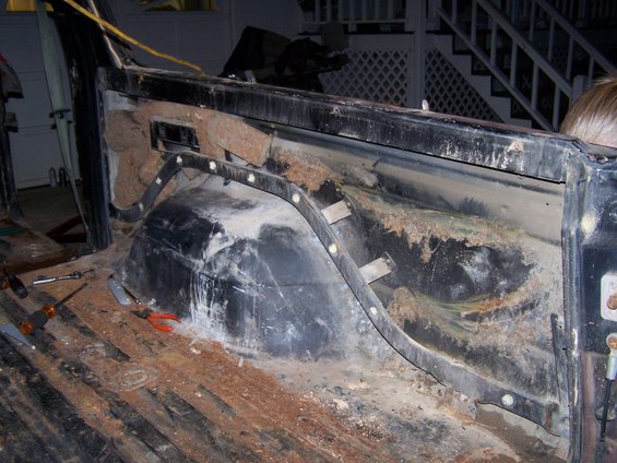 1979 Ford F-150 interior showing rust and exposed insulation in the truck bed