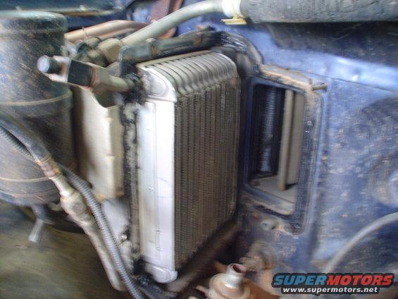 Heater core assembly removed from vehicle, showing fins and surrounding ductwork