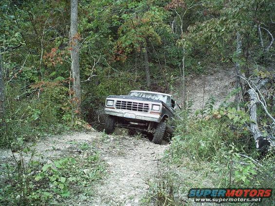 1980s Ford Bronco navigating an off-road trail