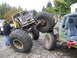 1990 Ford Bronco - Modified off-road vehicles are shown in a challenging outdoor environment.