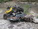 1990 Ford Bronco - A custom buggy is perched atop a severely damaged pickup truck in a rocky, outdoor setting.