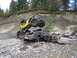 1990 Ford Bronco - Off-road buggy perched precariously on a severely damaged pickup truck in a rough terrain.