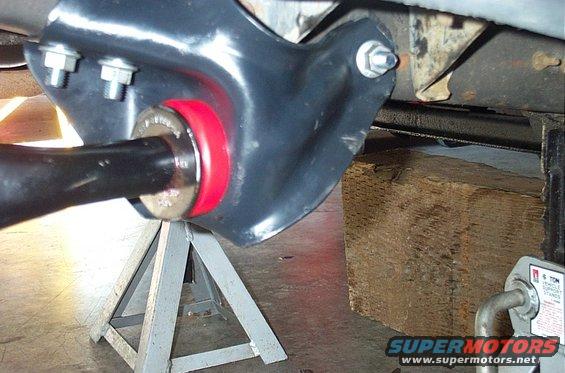 Suspension part with red bushing on jack stands