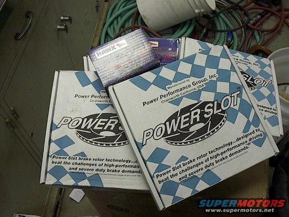 Boxes of Power Slot brake rotors and Hawk brake pads