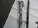 1997 Ford Crown Victoria - A broken metal component and rod are shown on a paper towel, with a website address visible.