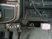 1988 Ford Bronco - Aftermarket CB radio and power inverter installed in the dashboard area of a vehicle.