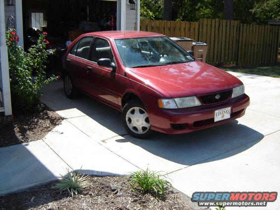 Red 1998 Nissan Sentra parked in driveway