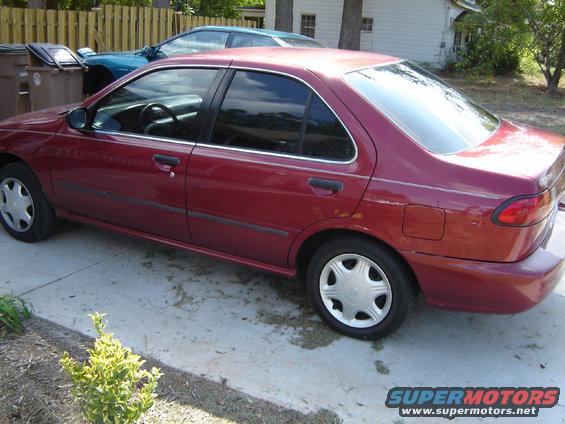 Red 1998 Nissan Sentra, rear quarter view