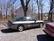 1996 Ford Probe - A 1996 Ford Probe is parked on a gravel lot with a pink car to its right.