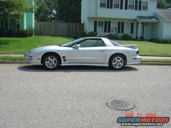 Silver 1998 Pontiac Firebird parked on street, side view
