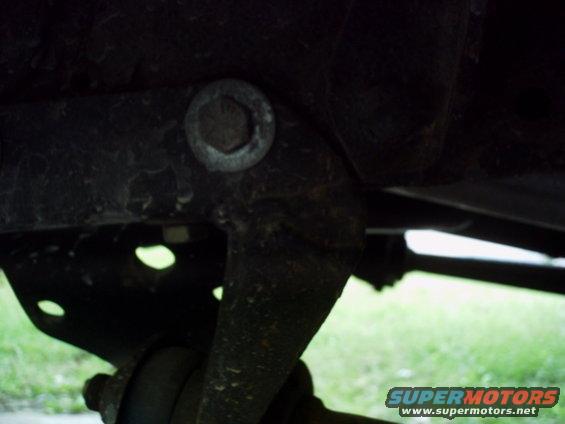 Undercarriage part with a circular bolt head