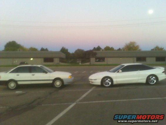 White Ford Probe and another white sedan parked in a lot