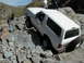 1993 Ford Bronco - White 1993 Ford Bronco tackling a difficult rocky terrain.