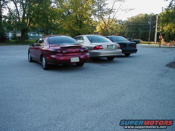 Red sedan from rear, 1996 model year
