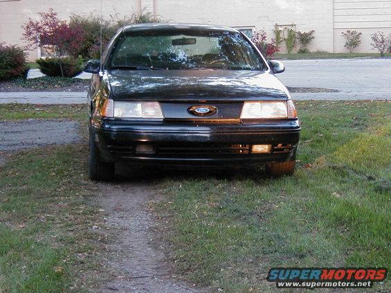 1990 Ford Taurus front view parked on a dirt path