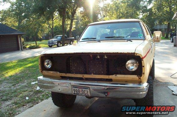 1978 Dodge Power Ram front end, grille removed, parked in driveway. Another truck is visible in the background