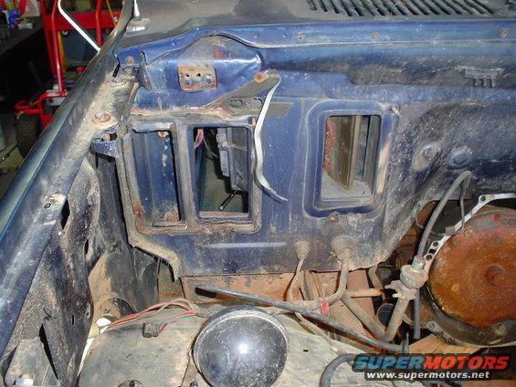 Interior firewall with vents and exposed wiring