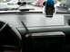 1988 Ford Bronco - Interior view of a vehicle's dashboard, showing aftermarket accessories like a GPS and radar detector.