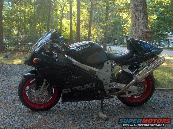Black Suzuki motorcycle with red rims and Yoshimura exhaust