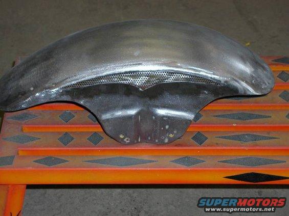 Bare metal motorcycle fender with perforated grille section