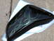 1998 Suzuki VL 1500 Intruder Classic - A black motorcycle fuel tank with custom green flame airbrushing is shown resting on a white towel.