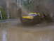 1990 Ford Bronco - 1990 Ford Bronco splashes through a muddy water crossing.