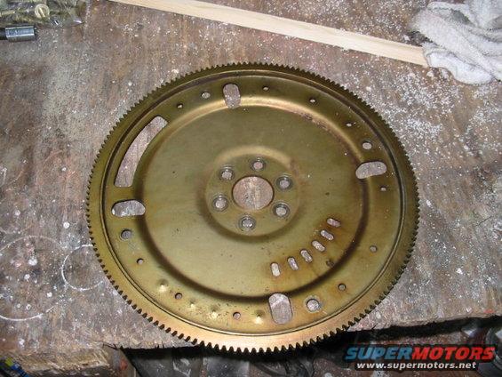 Flywheel with gear teeth on a workbench