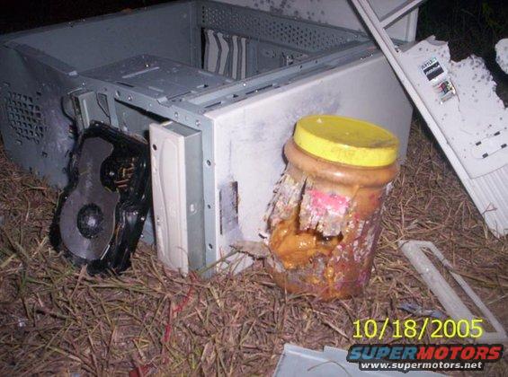 1_0322.jpg The jar...also the HDD on the left....don't know HOW that CD drive in the case is still in tact...didn't even get scratched!