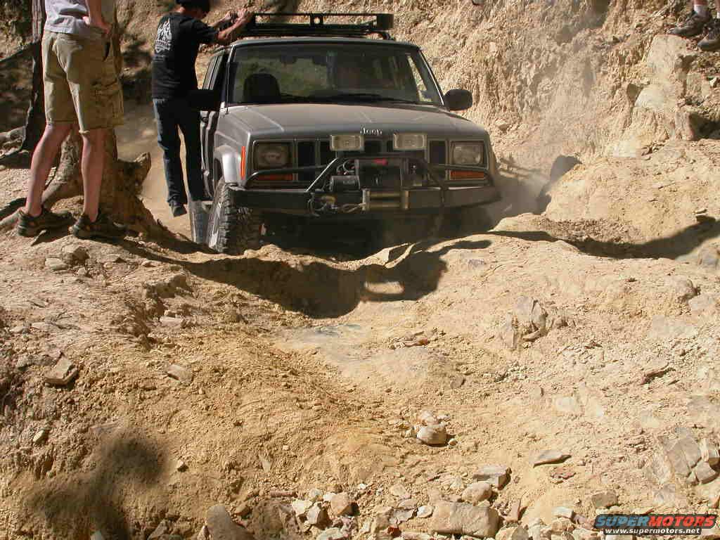 This Cherokee was entirely too nice to be out here, it didn't have a ding on it anywhere I could see.  You can see in this pic that he needed some extra weight on the passenger side to get the traction to get over that ledge.