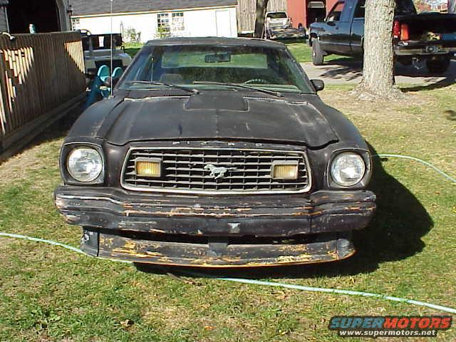1978 Ford Mustang II front view, black paint, worn bumper