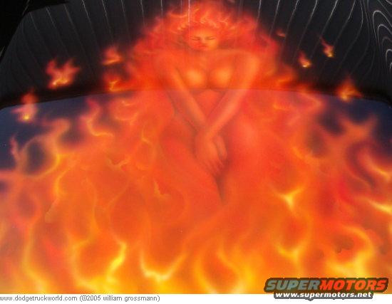 Hood airbrushed with flames and a woman; black background with pinstripes