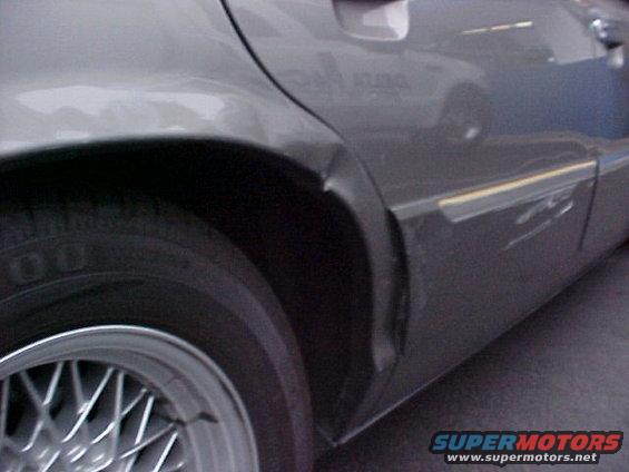2000 Mercury Grand Marquis rear quarter panel dented near wheel well