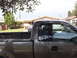 2004 Ford F-150 - Gray 2004 Ford F-150 pickup truck parked in a residential driveway with another vehicle behind it.
