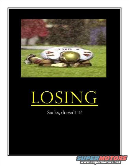 Football player in uniform lying on grass, text "LOSING Sucks, doesn't it?"