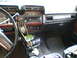 1981 Ford Bronco - Interior view of a 1981 Ford Bronco, showing the dashboard with wood-grain accents and a "Ranger XLT" badge.