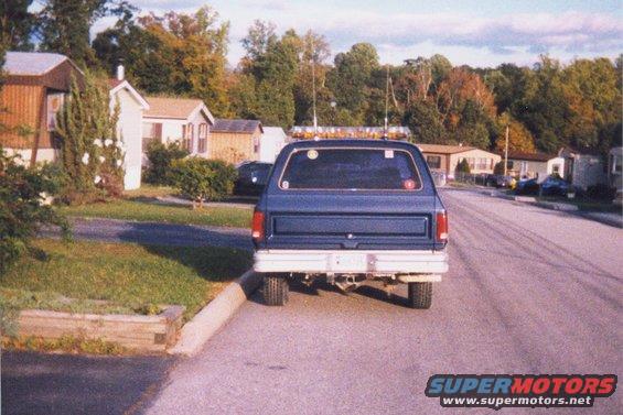 1990 Dodge Ramcharger rear view, parked on street in front of mobile homes