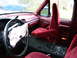 1994 Ford Bronco - The interior of the vehicle shows signs of a collision, including a deployed airbag and broken glass.