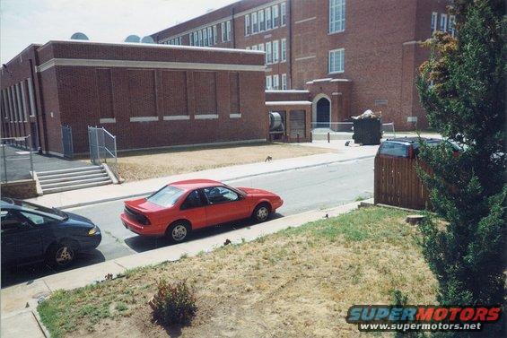 Red 1996 Chevrolet Beretta coupe parked curbside