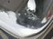 1999 Mitsubishi 3000GT - Close-up of a damaged chrome rim, showing signs of corrosion and wear.