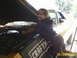 1973 Ford Ranchero - 7-year old daughter wrenching away on a front shock. Bringing her up right!