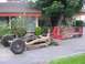 1979 Chevrolet C/K Pickup - Disassembled truck chassis and bed sitting on a driveway in front of a house.