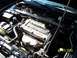 1997 Mitsubishi Eclipse - Close-up view of the engine compartment, highlighting the DOHC 16 valve engine.